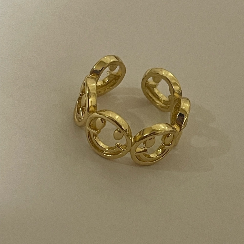 Gold toned adjustable smiley face ring​​​​
